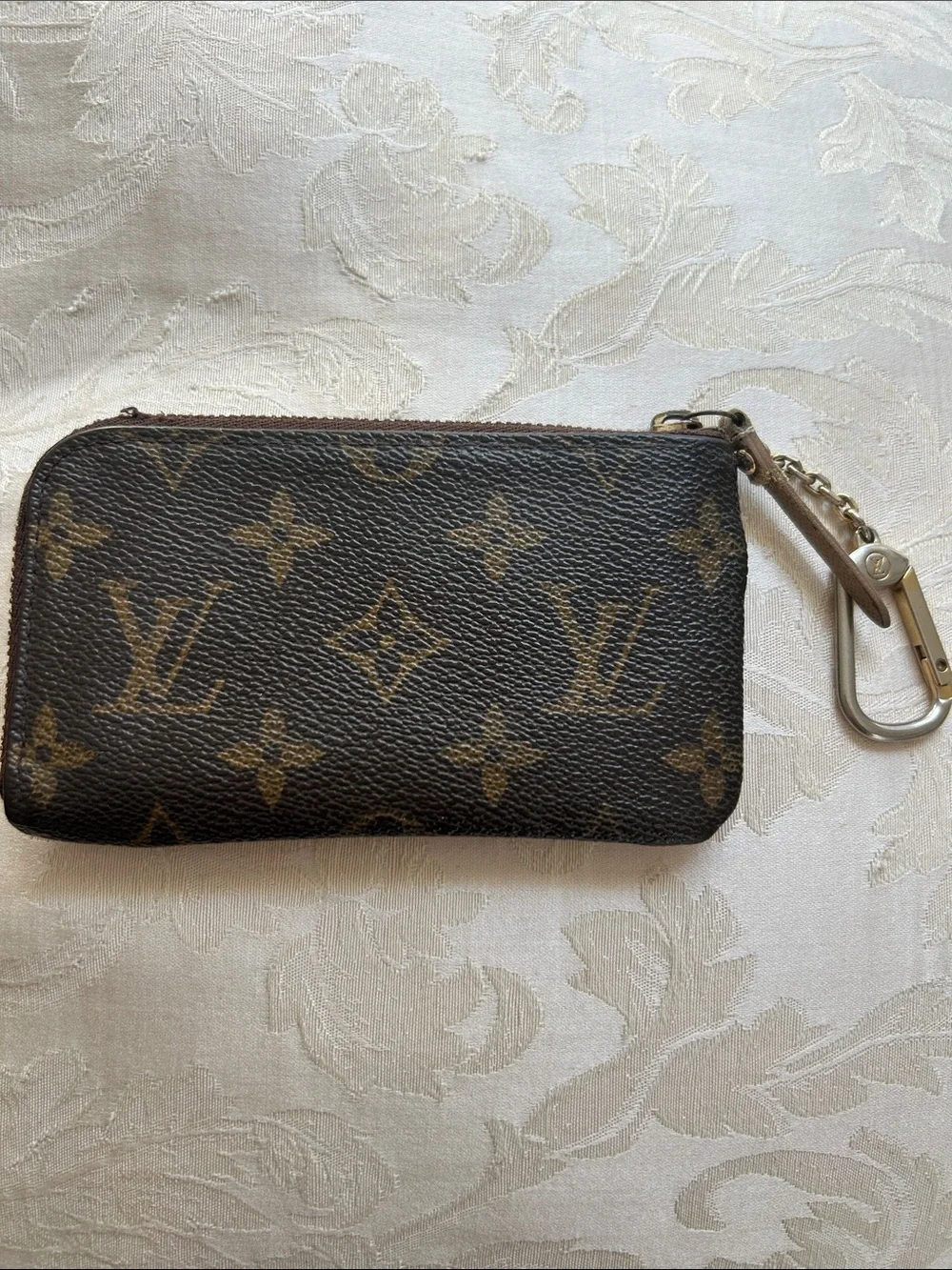 7066. Authentic Louis Vuitton Trunks & Bags Monogram Key/Coin Purse. Comes w/COA